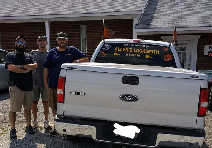 Allen and two of the crew standing beside the Allen's Locksmith pickup